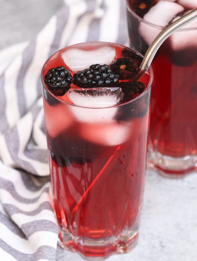 Make a delicious Very Berry Hibiscus Refresher at home! This Starbucks copycat recipe gives you all the refreshing flavor and beautiful color of the store-bought iced beverage at the fraction of the price. It’s incredibly easy to make the tea-based drink and you can easily customize by adding lemonade or coconut milk! #VeryBerryHibisucs #VeryBerryHibiscusRefresher