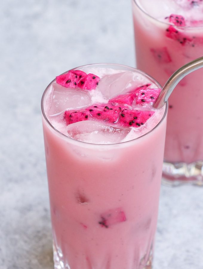 Make the stunning Insta-worthy Dragon Drink at home! It’s very similar to Mango Dragonfruit Refresher, but sweeter and creamier! This Starbucks copycat recipe is a real deal with the bright pink color and refreshing flavors! The best part? You can easily customize it to your preferred level of sweetness, and make it with or without caffeine! #DragonDrink #StarbucksDragonDrink