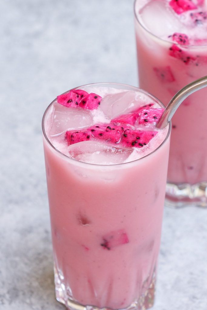 Make the stunning Insta-worthy Dragon Drink at home! It’s very similar to Mango Dragonfruit Refresher, but sweeter and creamier! This Starbucks copycat recipe is a real deal with the bright pink color and refreshing flavors! The best part? You can easily customize it to your preferred level of sweetness, and make it with or without caffeine! #DragonDrink #StarbucksDragonDrink