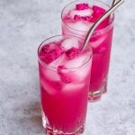 The beautiful pink Mango Dragonfruit Lemonade is a perfect summer refreshing drink that you can enjoy year-round. This easy Starbucks copycat recipe takes less than 5 minutes to make with only 4 ingredients. The dragon fruit powder gives this refresher a vibrant pink color, while the lemonade adds extra tropical fruity flavors to the iced beverage!