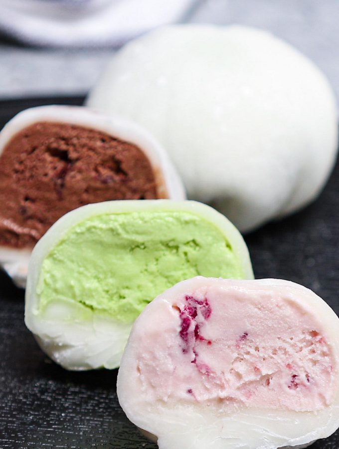 Mochi Ice Cream – sweet and creamy ice cream wrapped in smooth and pillowy mochi dough! It will float into your mouth and disappear! This easy Japanese dessert recipe makes a batch of the most delicious and dainty ice cream mochi balls with different flavors. Try strawberry, green tea matcha, or chocolate! #MochiIceCream #Mochi