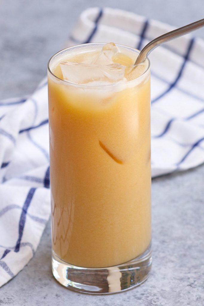 This new Orange Drink from Starbucks’ secret menu tastes like Peach Gummy Rings! It’s made with black tea lemonade, peach juice, and soy milk. We’ve created this homemade iced beverage to brighten up your day and it tastes like the real thing. A perfect and refreshing drink for the summer! #OrangeDrink #StarbucksOrangeDrink