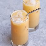 This new Orange Drink from Starbucks’ secret menu tastes like Peach Gummy Rings! It’s made with black tea lemonade, peach juice, and soy milk. We’ve created this homemade iced beverage to brighten up your day and it tastes like the real thing. A perfect and refreshing drink for the summer! #OrangeDrink #StarbucksOrangeDrink