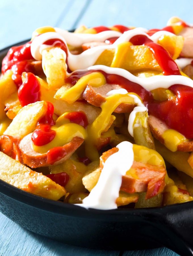 Salchipapas is a local Peruvian street food. But you can easily make it at home with homemade French fries and pan-fried hot dogs. This fast food is perfect for parties, game days, or other special occasions when you crave a tasty and comfort appetizer or meal. #Salchipapa #Salchipapas
