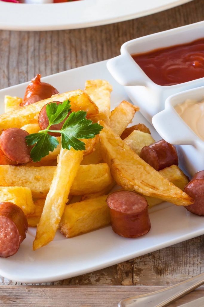 Salchipapas is local Peruvian street food. But you can easily make it at home with homemade French fries and pan-fried hot dogs. This fast food is perfect for parties, game days, or other special occasions when you crave a tasty and comfort appetizer or meal. #Salchipapa #Salchipapas