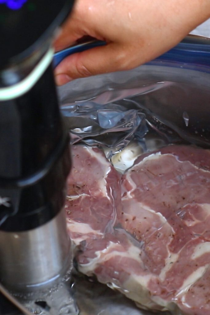 Vacuum-sealing a zip-loc bag using "water displacement" method.