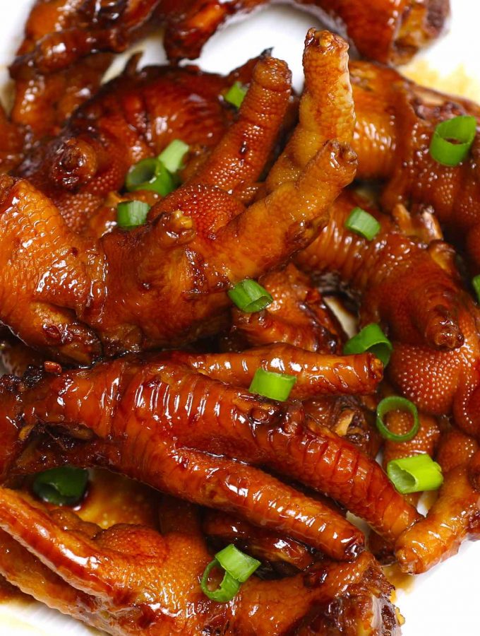 These braised Chicken Feet are cooked long and slow in a rich sauce – so tender and flavorful! This healthy recipe rivals what you would find in the best Chinese Dim Sum restaurant. The best part? No deep-frying required! #ChickenFeet #ChickenFeetRecipe #ChickenFeetDimSum