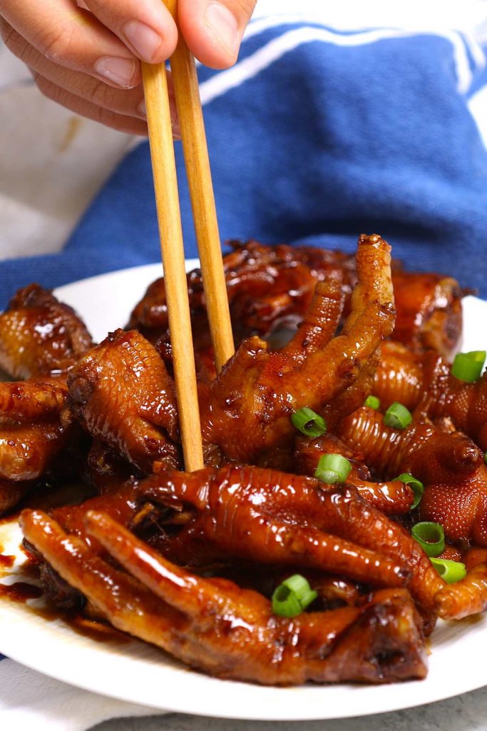 These braised Chicken Feet are cooked long and slow in a rich sauce – so tender and flavorful! This healthy recipe rivals what you would find in the best Chinese Dim Sum restaurant. The best part? No deep-frying required! #ChickenFeet #ChickenFeetRecipe #ChickenFeetDimSum