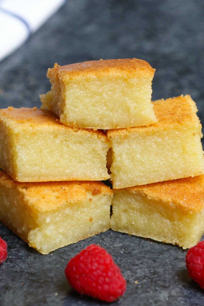 This classic Hawaiian Butter Mochi is soft, sticky, chewy, and buttery – melt-in-your-mouth delicious! A tropical treat made with mochiko glutinous rice flour and coconut cream, this mochi cake is incredibly easy to make. Here’s a step-by-step guide on how to make this dessert at home. #ButterMochi #ButterMochiRecipe #HawaiianButterMochi