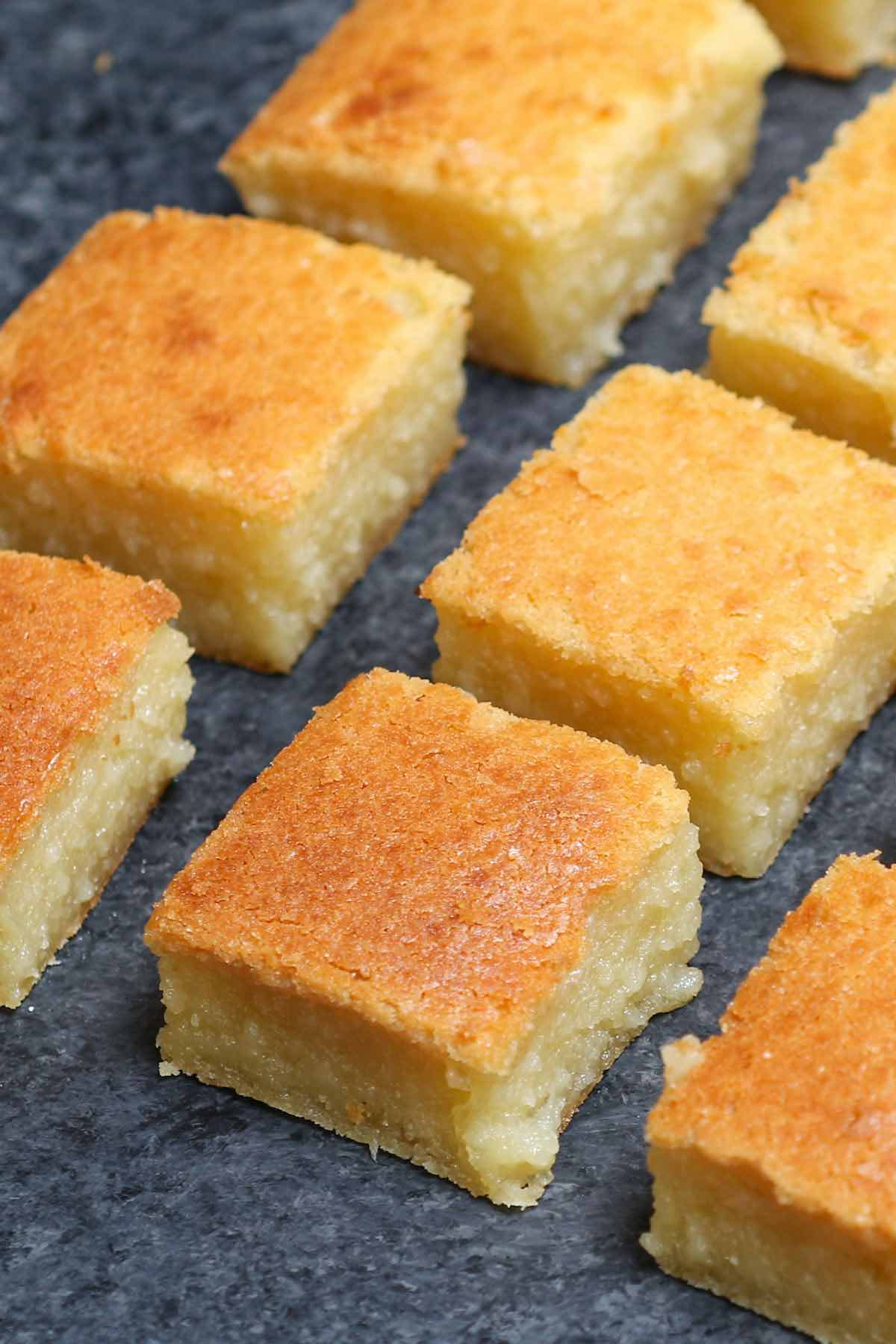 Closeup of freshly baked butter mochi squares.
