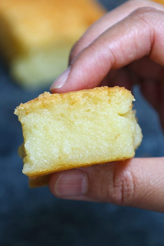 This classic Hawaiian Butter Mochi is soft, sticky, chewy, and buttery – melt-in-your-mouth delicious! A tropical treat made with mochiko glutinous rice flour and coconut cream, this mochi cake is incredibly easy to make. Here’s a step-by-step guide on how to make this dessert at home. #ButterMochi #ButterMochiRecipe #HawaiianButterMochi