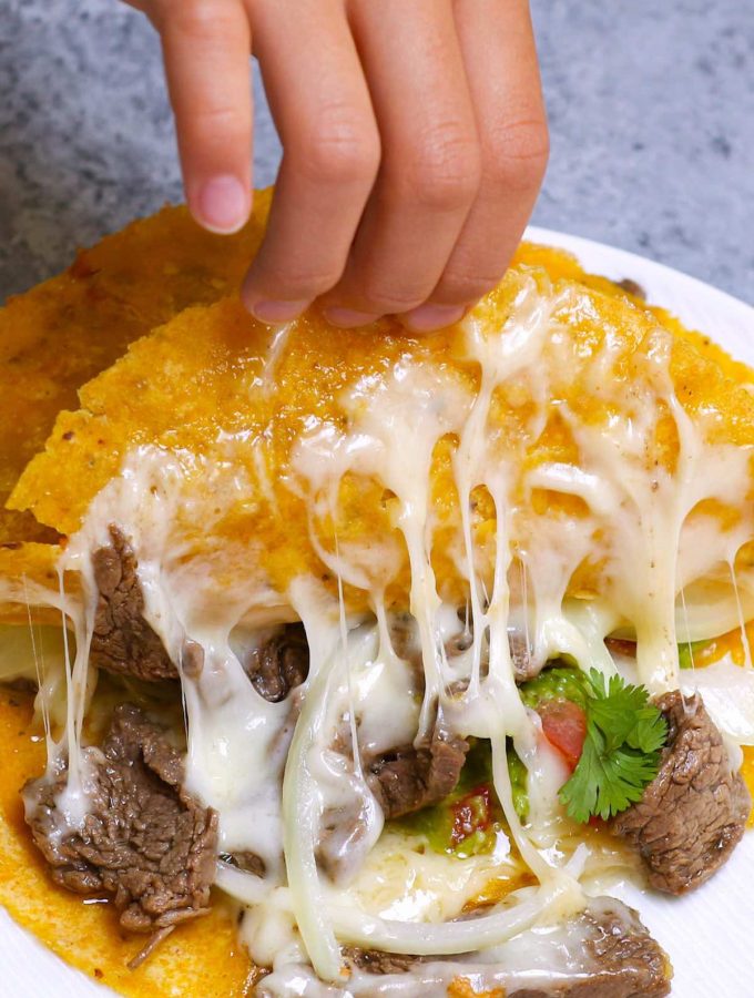 Mulitas are basically a double-deck quesadilla with two tortillas and meat on the inside. They’re loaded with gooey melted cheese and a flavorful carne asada, with crispy tacos on both sides. Talk about mouth-watering Mexican comfort food everyone loves! #Mulitas