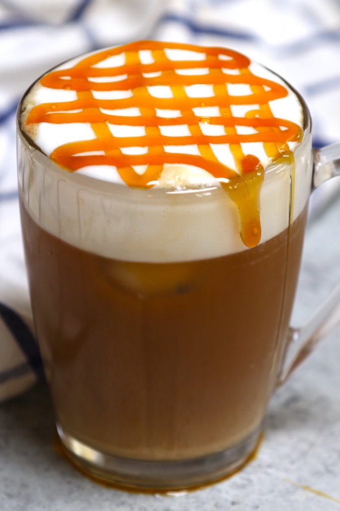 Try this copycat recipe of the popular Starbucks drink – Caramel Could Macchiato! Airy, foamy, full of delicious espresso and vanilla flavor, then topped with buttery caramel sauce. This Starbucks cloud macchiato recipe is not to be missed! #IcedCloudMacchiato #CloudMacchiato #CaramelCloudMacchiato