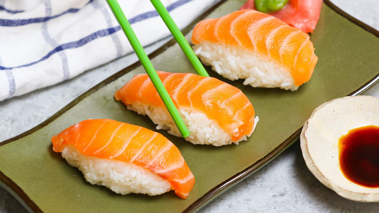 Salmon Nigiri made with sashimi-grade salmon and fluffy sushi rice! It’s so much cheaper than the restaurant, and incredibly easy to make at home. I’ll share with you the secrets to cut salmon for nigiri or sashimi and how to make salmon nigiri sushi with step by step photos.