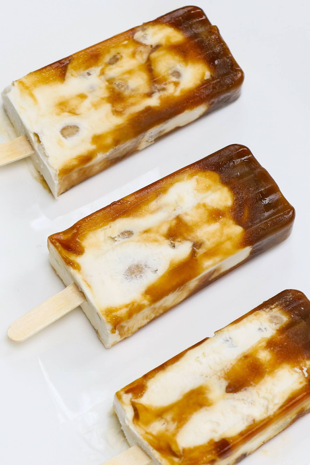 Ever tried Brown Sugar Boba Ice Cream Bars? This Asian frozen dessert has been a viral sensation around the world recently. It has a delicious combination of sweet, creamy ice cream and soft, chewy bubble tea pearls. Here is an easy recipe showing you how to make this special treat at home, rivaling the popular Shao Mei Boba popsicles. #BobaIceCream #BobaIceCreamBar #BrownSugarBobaIceCream