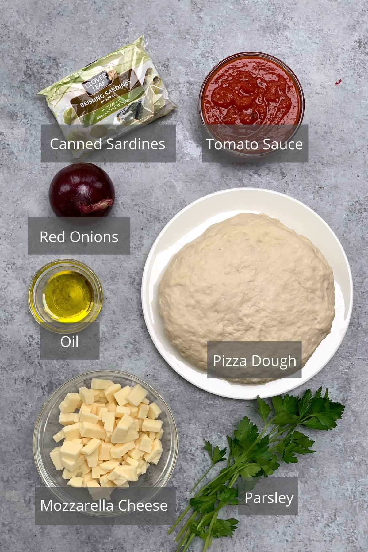 Sardine Pizza ingredients on the counter.