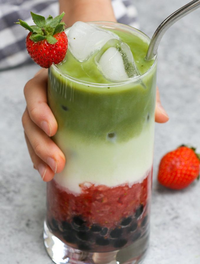 Ever wondered how to make Boba Guys’ insta-worthy layered Strawberry Matcha Latte? Here is an easy and simple bubble tea strawberry matcha latte recipe that shows how to make this creamy iced drink at home! It’s creamy, refreshing, and loaded with soft and chewy boba milk tea pearls. #StrawberryMatchaLatte #BobaStrawberryMatcha