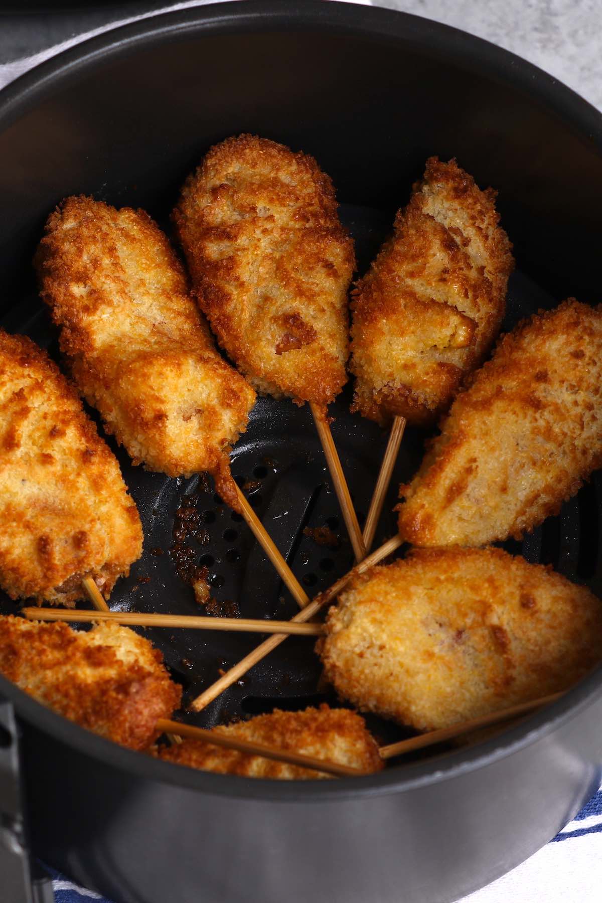 These crispy and crunchy Air Fryer Corn Dogs are made from scratch without deep-frying! A healthy corn dog recipe that everyone loves! We’ve also included instructions on how to air fry frozen corn dogs if you’d like to cook them straight from the freezer! 