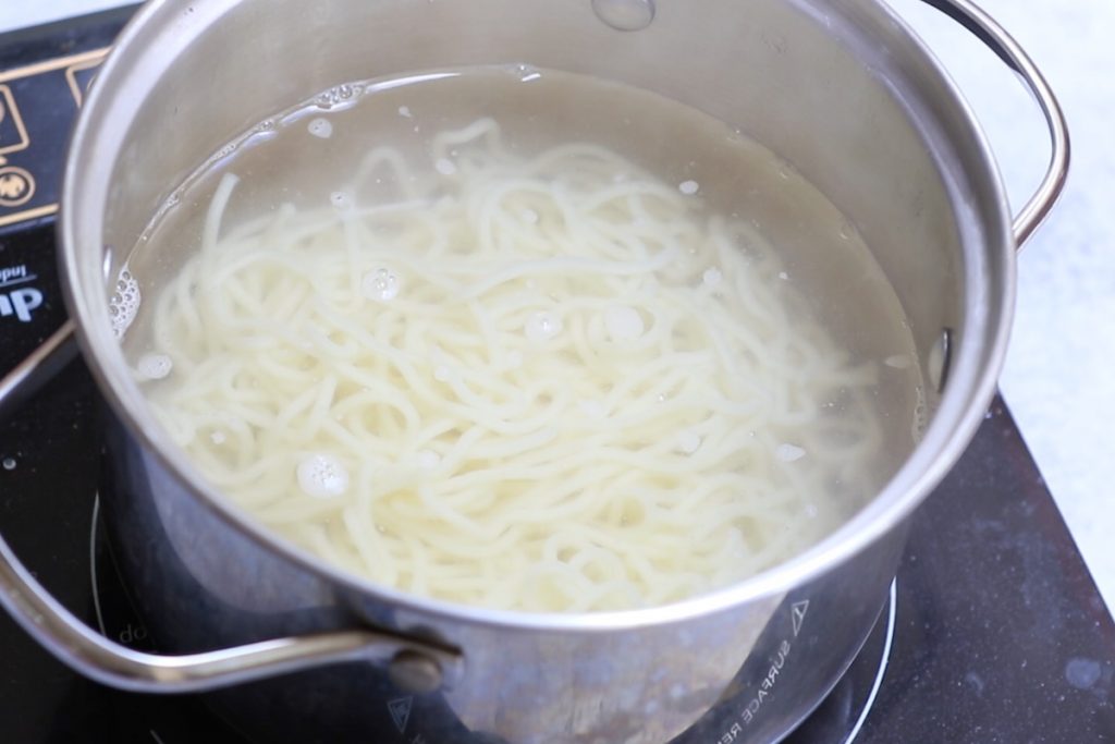 Cooking ramen noodles.