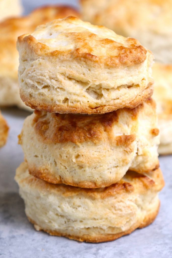 Closeup of Popeyes buttermilk biscuits showing the flaky texture.