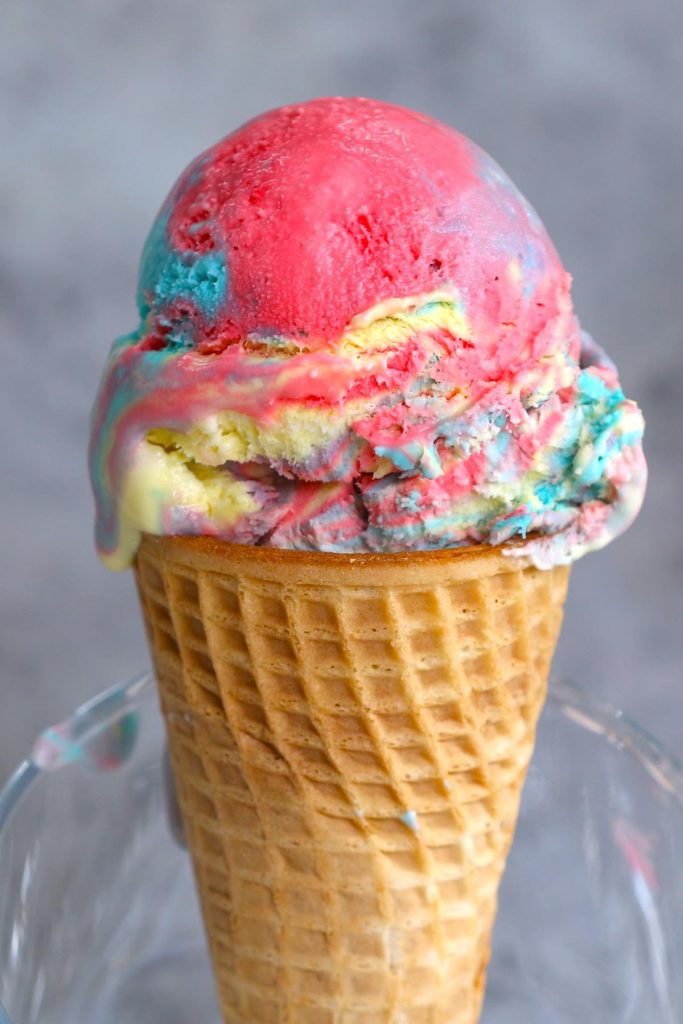 Looking for a fun way to cool down on a hot day? Look no further than Superman Ice Cream – Michigan’s favorite ice cream flavor! Our homemade vanilla superman ice cream comes as a swirl of 3 colors: blue, red, and yellow, just like the colors of Superman’s costume. This easy recipe will have you indulging in a sweet rainbow scoop in very little time.