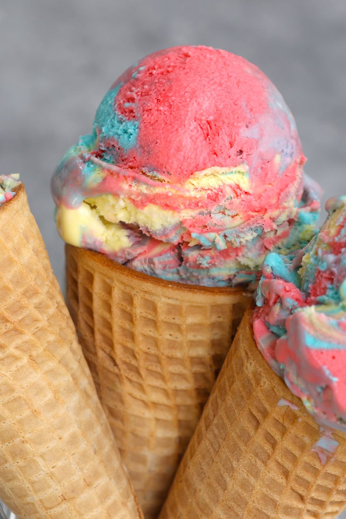 Looking for a fun way to cool down on a hot day? Look no further than Superman Ice Cream – Michigan’s favorite ice cream flavor! Our homemade vanilla superman ice cream comes as a swirl of 3 colors: blue, red, and yellow, just like the colors of Superman’s costume. This easy recipe will have you indulging in a sweet rainbow scoop in very little time.