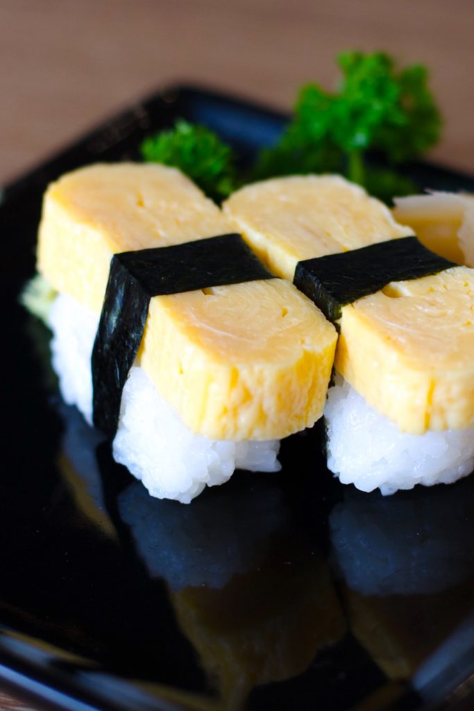 Tamago Sushi is sweet and savory, with a light, fluffy texture. It’s made with Japanese rolled omelet (Tamagoyaki) and seasoned sushi rice. This classic egg sushi is a favorite for adults and children alike and is usually served for breakfast or as a side dish in a bento box. Tamagoyaki is also delicious when served on top of sushi rice.