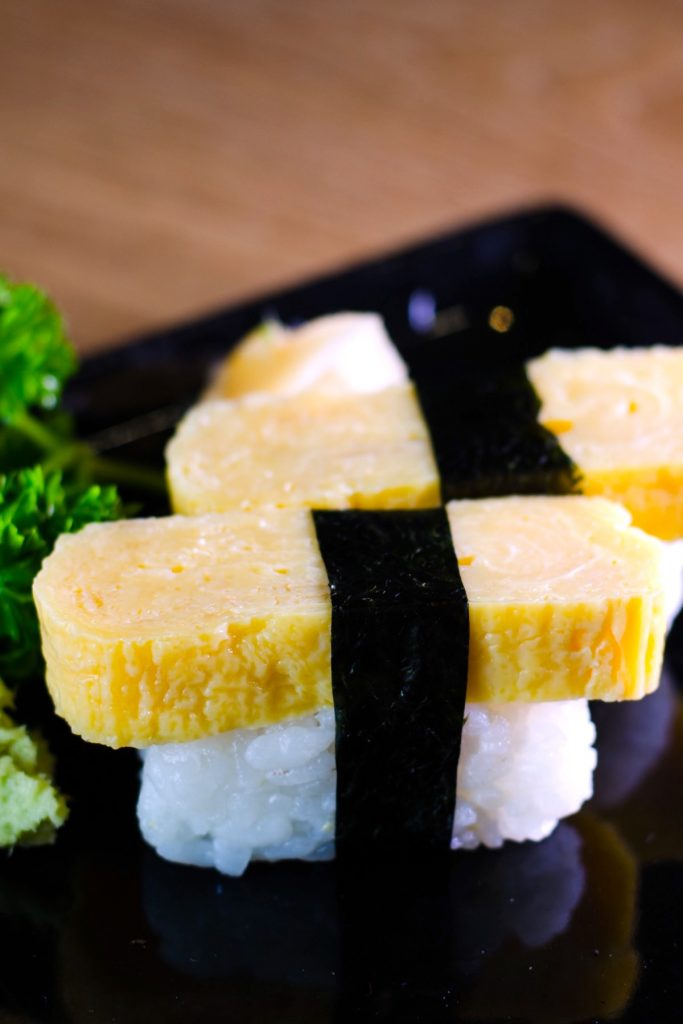 Tamago Sushi is sweet and savory, with a light, fluffy texture. It’s made with Japanese rolled omelet (Tamagoyaki) and seasoned sushi rice. This classic egg sushi is a favorite for adults and children alike and is usually served with Japanese breakfasts or as a side dish in a bento box. Tamagoyaki is also delicious when served on top of sushi rice. 