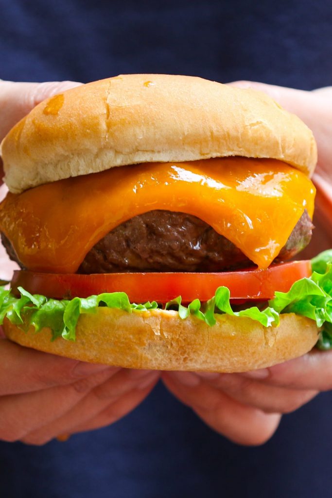 Closeup of a perfectly cooked hamburger.