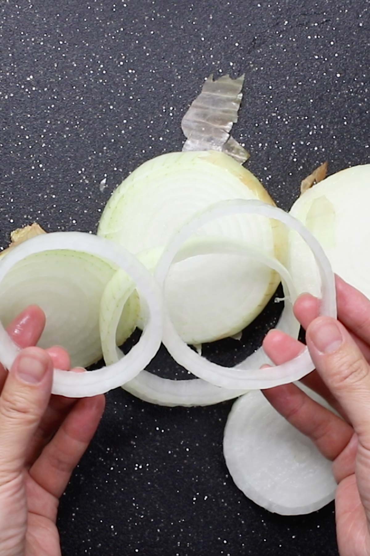 Photo showing cutting and separating onion rings.