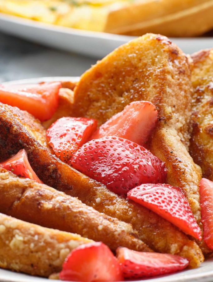 The sweet and buttery IHOP French Toast is super easy to make and perfect for weekend breakfast! The balanced flavors are soaked into brioche bread, with a hint of cinnamon and vanilla. Serve with strawberries or bananas, and this is the recipe your whole family will go crazy for.