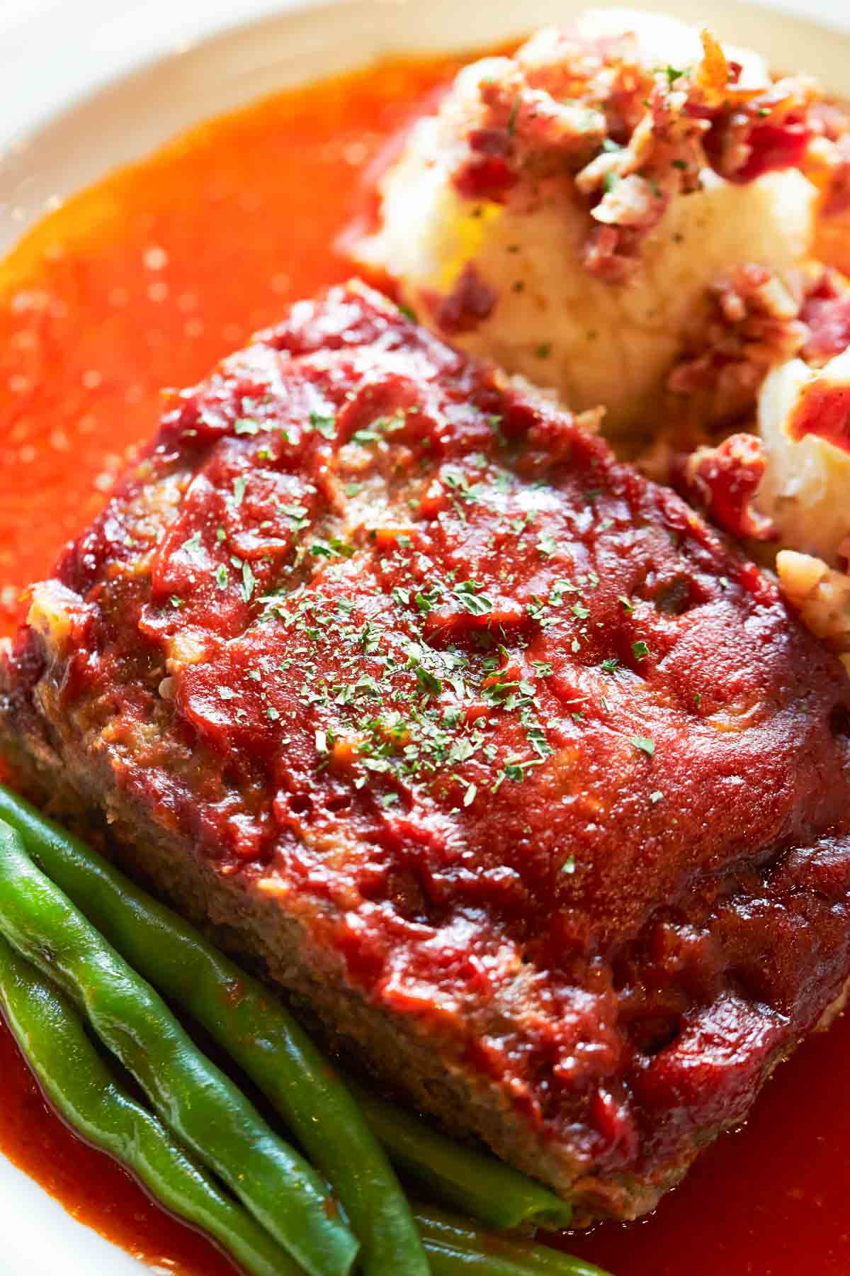 Lipton Onion Soup Meatloaf comes out so tender, juicy, and flavorful every single time! This copycat recipe is made with just 6 simple ingredients and minimal prep time. A packet of Lipton Onion Soup Mix is the key to a well-seasoned loaf that’s full of flavor. 
