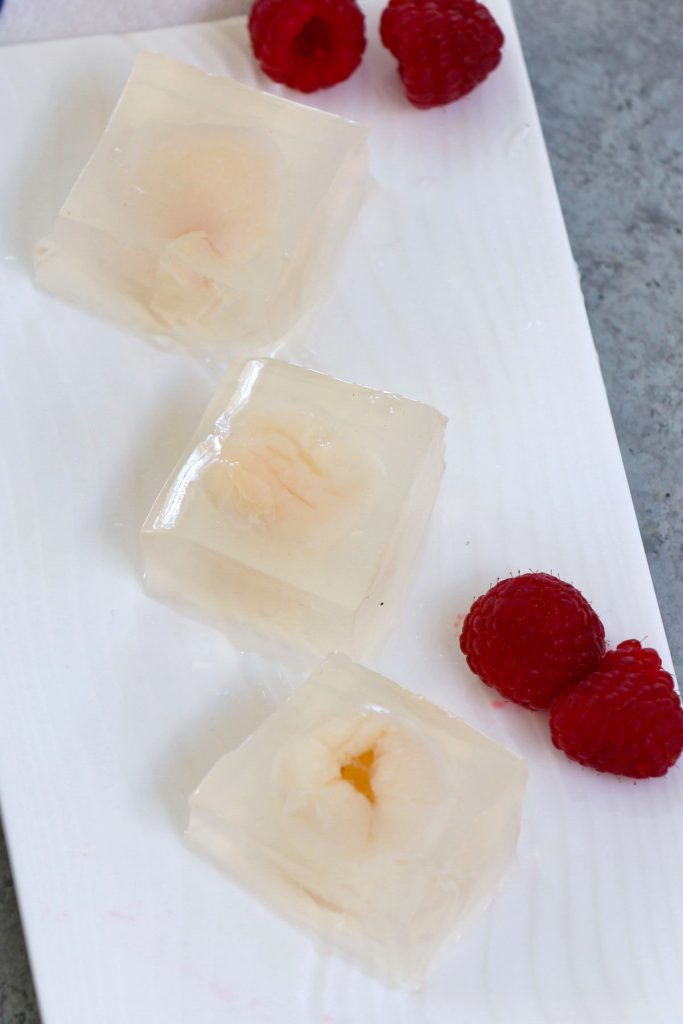 Lychee Jelly is a jiggly Chinese dessert that's made with coconut water, lychee fruits, and agar agar. These delightful vegan sweet cubes are a lovely treat on a hot summer day. You can use gelatin for a non-vegan option. Add it to your iced tea for a fruity alternative to boba bubble tea!