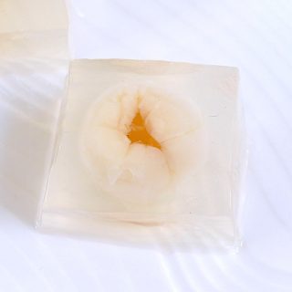 Lychee Jelly is a jiggly Chinese dessert that's made with coconut water, lychee fruits, and agar agar. These delightful sweet cubes are a lovely treat on a hot summer day. You can use gelatin for a non-vegan option. Add it to your iced tea for a fruity alternative to boba bubble tea!