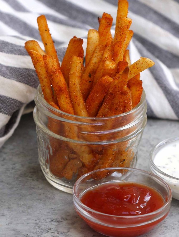 These homemade copycat Popeyes’ Cajun Fries are crispy on the outside, fluffy on the inside, with the perfect kick. They taste the same if not better than the fast-food French fry. What distinguishes these Popeyes Fries is an irresistible mix of seasonings for an authentic Cajun treat.