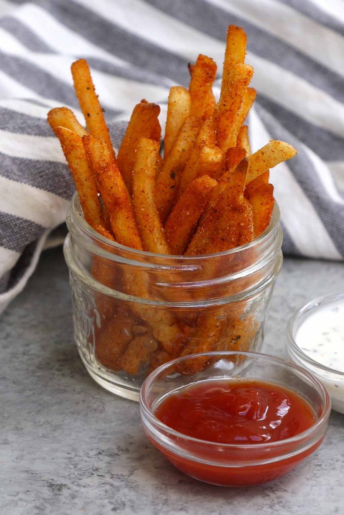 These homemade copycat Popeyes’ Cajun Fries are crispy on the outside, fluffy on the inside, with the perfect kick. They taste the same if not better than the fast-food French fry. What distinguishes these Popeyes Fries is an irresistible mix of seasonings for an authentic Cajun treat.