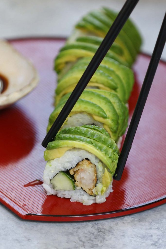 The Dragon Roll is one of the all-time best sushi dishes at Japanese restaurants. Filled with shrimp tempura and cucumber, dragon roll sushi has a delicious avocado topping, resembling the scales of a dragon. We’ll share all the tips and tricks so that you can easily make them at home!