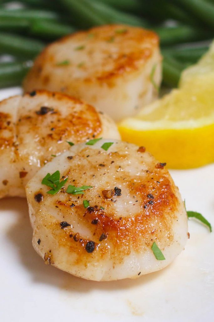 Scallops are gourmet seafood that’s buttery with a mild texture. The unique, slightly sweet flavor has earned them the nickname “the candy of the sea.” Their tender, succulent meat is sure to delight fans of lobster and crab. This expensive seafood is especially delicious in a buttery lemon garlic sauce (recipe below!)