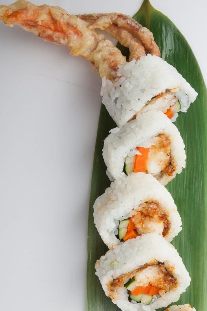 Spider Roll Sushi is filled with soft-shell crab tempura, cucumber, and carrots, then rolled in sushi rice and nori seaweed sheet. The crab legs look like spider legs, which gave this tasty roll its name. The Spider Roll does not have any raw fish, making it ideal for those who simply do not like raw sushi. Serve it as an appetizer or snack with wasabi and soy sauce.