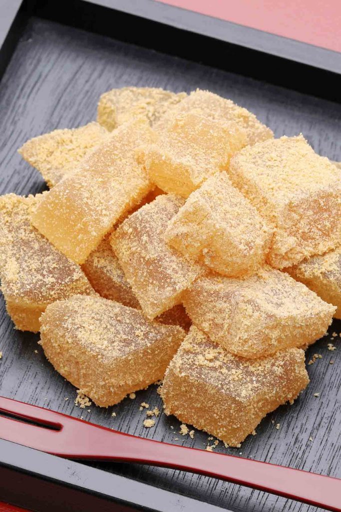 Looking for a fun and refreshing summertime treat recipe? This chilled Japanese dessert is exactly what you need. Warabi Mochi is a soft, chewy, and jelly-like confection that you can make with just a few ingredients. It’s made with warabiko, different from the mochi made with glutinous flour, but gets its name from the similarity in texture. Warabimochi is often dipped in kinako soybean powder, with an amazing nutty flavor!