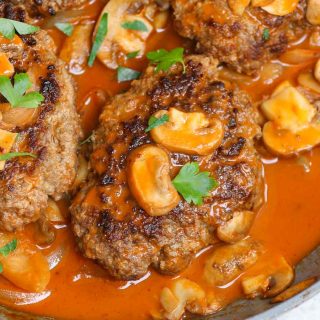 Bobby Flay Salisbury Steak is a comfort food that’s so easy to make. Juicy, well-seasoned beef patties are cooked to perfection in creamy, savory mushroom gravy. It couldn’t be easier to prepare a Salisbury steak recipe for a hearty weeknight dinner the whole family will enjoy.