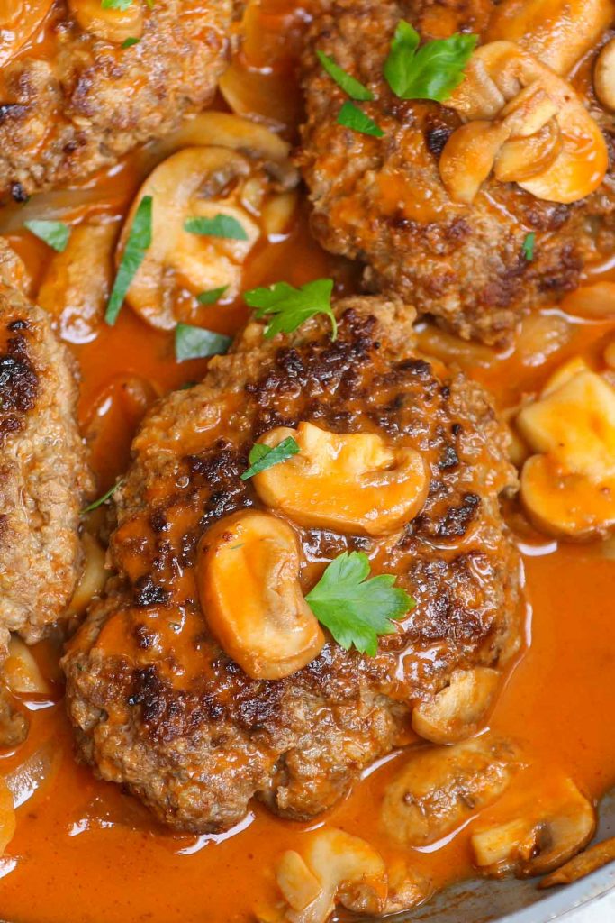 Bobby Flay Salisbury Steak is a comfort food that’s so easy to make. Juicy, well-seasoned beef patties are cooked to perfection in creamy, savory mushroom gravy. It couldn’t be easier to prepare a Salisbury steak recipe for a hearty weeknight dinner the whole family will enjoy.