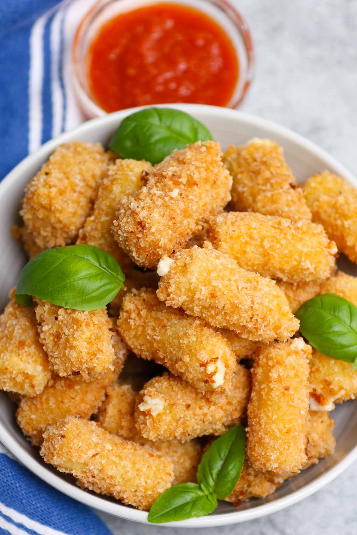 Olive Garden is known for its delectable Italian menu items, including appetizers. For those who want to go beyond breadsticks, this copycat Stuffed Ziti Fritta is crispy, cheesy and packed with flavors. Cooked rigatoni pasta is stuffed with a delicious cheese mixture and then fried to golden perfection!