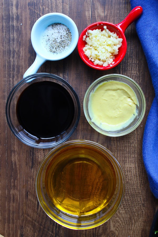 Balsamic vinaigrette ingredients on the counter.