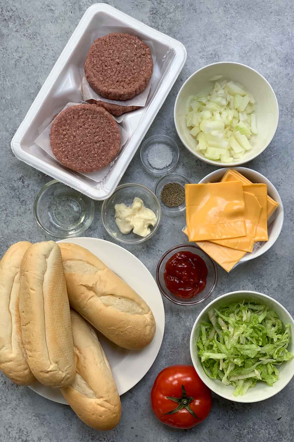 Chopped cheese sandwich recipe ingredients on the counter.