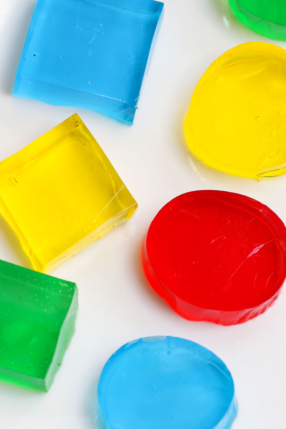 Jello Jigglers are fun, fruity, and colorful! It couldn’t be easier to make these kid-friendly jiggly snacks with just 3 simple ingredients and cookie cutters. I’ll share with you the tricks to get them perfect EVERY TIME. There are also many ways to customize this recipe: making it sugar-free, with alcohol, apple juice, or layered jello jigglers.