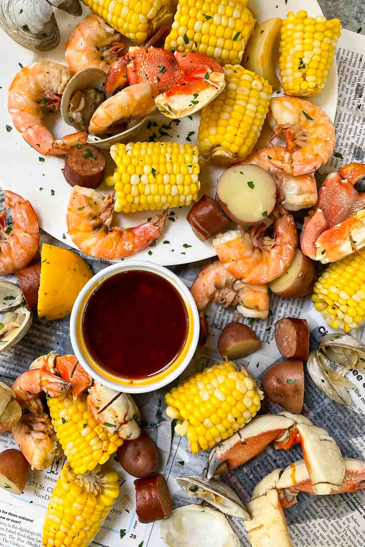 Best Homemade Seafood Boil Sauce is rich, spicy, buttery, and packed with garlic flavor! This seafood butter sauce recipe is easy to make and perfect with your favorite seafood boil, shrimp boil, crawfish boil, and crab boil.