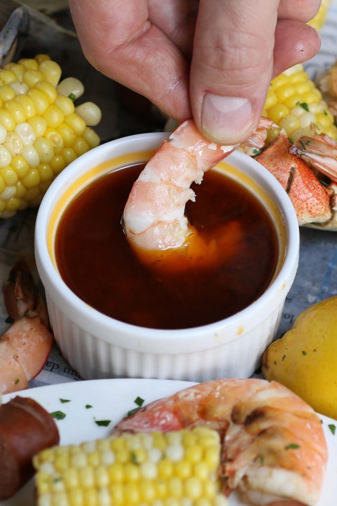 Best Homemade Seafood Boil Sauce is rich, spicy, buttery, and packed with garlic flavor! This seafood butter sauce recipe is easy to make and perfect with your favorite seafood boil, shrimp boil, crawfish boil, and crab boil.