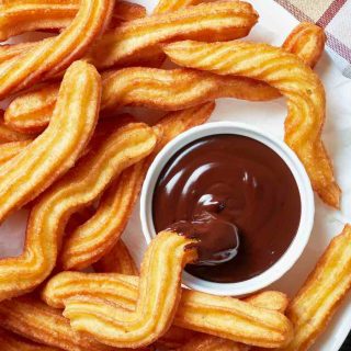 Churros are one of my favorite Spanish desserts. Made with some simple pantry items, they taste like cinnamon donuts!