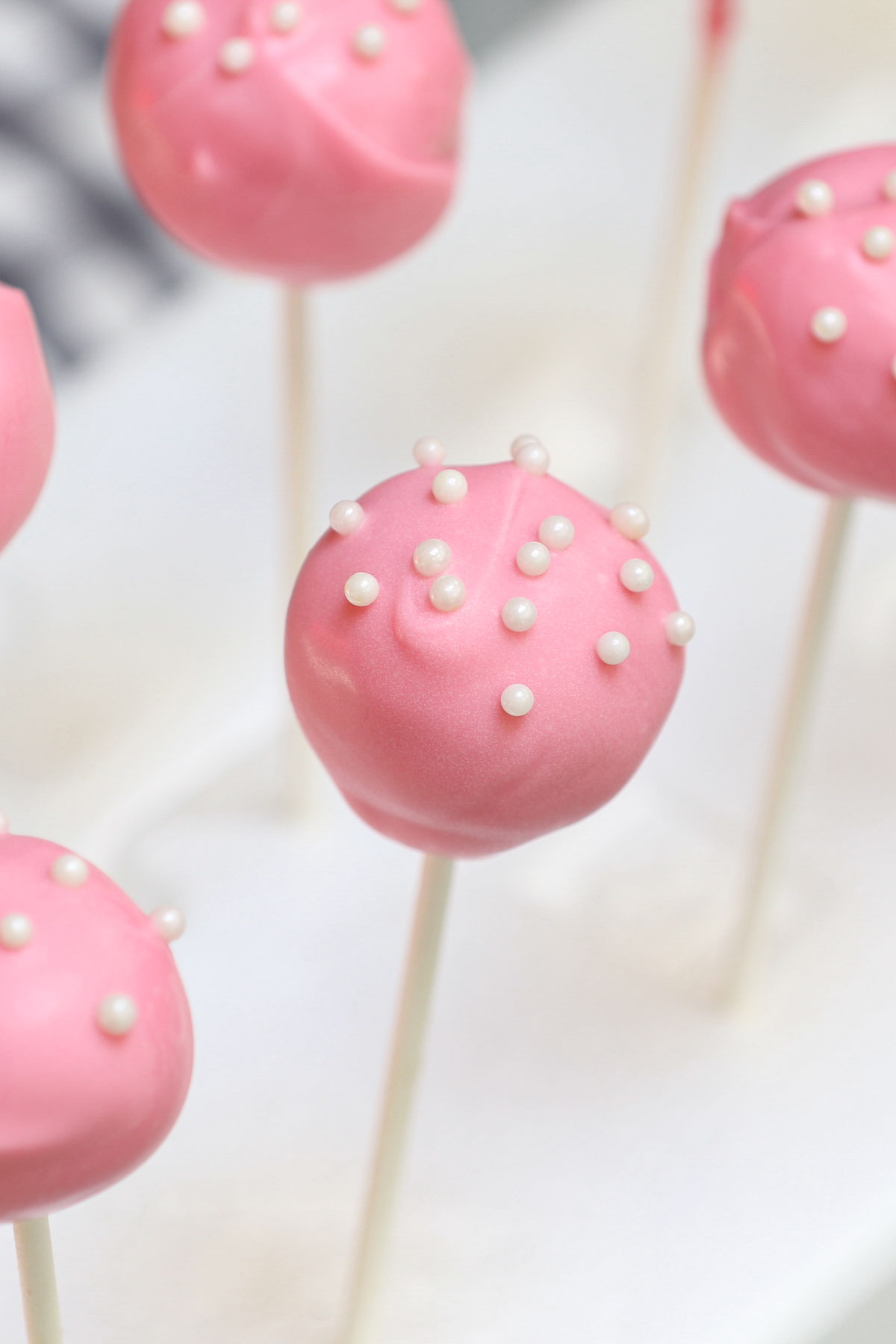 Cake pops are exactly what they sound like – a cross between a cake and a lollipop! These pink treats are perfect for birthday parties. Though made popular by the chain of coffee shops, these Starbucks Cake Pops can easily be recreated at home.